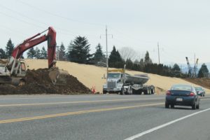 Rock and gravel has been trucked in from Skamania County and piled along the highway shoulder between Second and Sixth streets in Washougal in preparation for work on the state Route 14 improvement project.  Work is expected to get under way early this summer.