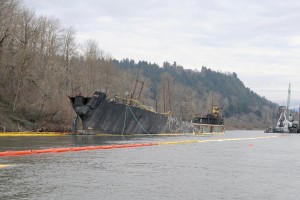 The Davy Crockett, a converted 431-foot flat deck barge, released an estimated 70-gallons of oil during a commercial salvage on Jan. 27. On Feb. 3, ballasting operations began after a week of planning by the Coast Guard, Washington Department of Ecology and Oregon Department of Environmental Quality. The stern was lowered a total of 17-feet in order to safely inspect the remaining compartments.