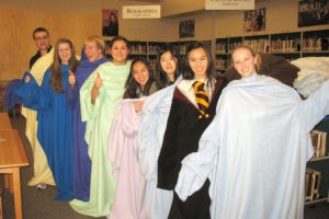 Key Club members proudly display the snuggies they made for the homeless. Pictured (right to left) are Brianna Scott, Ariel Orasud, Yu-An Lin, Christine Nghiem, Cassidy Hines, Kelly Wourms, Atalie Allen and Nick Jaech.