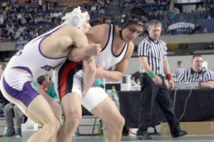 Miguel Salamanca (right) gets ready to throw Matt Owens during the championship match Saturday, in the Tacoma Dome.