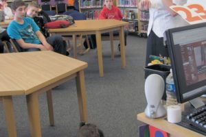 Maryalicia Verdecchia talks with students about her 2-year-old daughter Katie's rare brain operation. Despite having more than half of it removed in a surgery to help stop seizures, the toddler is excellent at spelling and putting together puzzles, and enjoys playing on her iPad, as seen here.