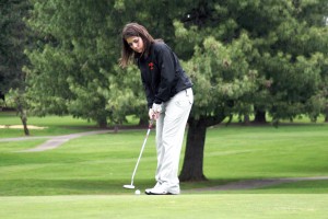 Taylor Carranza sinks her putt on the eighth hole Monday, at Orchard Hills Golf Club in Washougal.