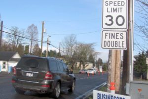 Signs serve as reminders to support businesses located along E Street, while driving at or less than the speed limit. The $8.1 million construction project includes the conversion of the road width to two through-lanes and a center left turn lane, and the addition of bike lanes and sidewalks from Sixth to 32nd streets. It is expected to be completed in August.