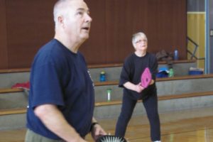 Mike Wolfe, of Washougal, and Dee St. Laurent, of Vancouver, are among the area residents who play pickleball at the Firstenburg Community Center. Wolfe and his wife Tawn (not pictured) are volunteer co-ambassadors for the sport. Mike Wolfe will teach beginning and advanced pickleball classes, starting April 20, in the Jemtegaard Middle School gym.