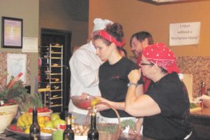 Last year's Iron Chef competitors inspect the various dinner ingredients to ensure the quality of the items. The 2011 event will be held at Camas Meadows. It is a benefit for the Camas Educational Foundation.