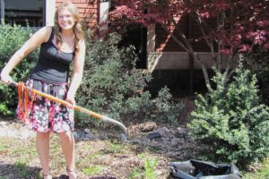 WHS senior Emily Carroll prepares to bury her time capsule in the school courtyard. It will be opened at her 50th high school reunion.