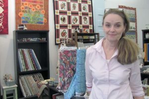 Nancy Sullivan sells an assortment of fabrics at River Quilts, in downtown Camas. There is also a selection of quilting thread and embroidery floss, as well as tins with pins, miniature jars of colorful new buttons and other accessories. The new business, which opened in March, is currently in need of additional teachers to provide classes at the shop. "I want it to be fun, open and friendly," Sullivan said. "When a customer walks in, I want them to feel inspired and welcomed."