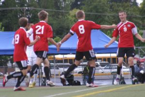 Parker Roland, Nate Beasley, Drew White and Adam Allison (inset, left to right) celebrate the first of seven goals for the Camas boys soccer team in the final four. Beasley scored two goals in the finals and one in the semifinals.