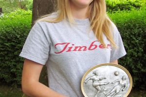 Heather Deuhlen proudly holds her Vancouver United Soccer Alliance Player of the Year award.