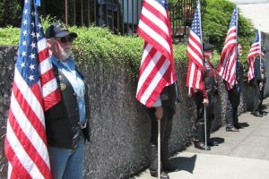 Patriot Guard Riders participate in a flag line outside Straub's Funeral Home, in Camas Friday, during the memorial service for Master Sgt. Ed Spencer. Spencer, of Washougal, was a decorated Army veteran who served two tours in Vietnam. "It is our way of honoring and thanking Master Sgt. Spencer for the self-sacrifices he made by serving our country," said Lynn Vaughn, a Southwest Washington ride captain. "If it were not for men and women such as he, there would be no United States of America."