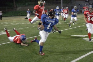 Camas High School graduate Miguel Salamanca (1) gallops for 74 yards Saturday, during the Shriners Freedom Bowl Classic at Kiggins Bowl.