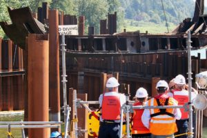 Spectators from "Unified Command" watch as the final 60-foot, 50,000 pound piece of steel from the derelict Davy Crockett vessel is lifted on Thursday from the Columbia River. The deconstruction project, which has been going on for the past seven months, will be complete in October.