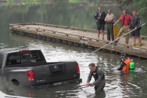 A 2006 Nissan Titan truck was pulled out of Lacamas Lake in Camas Monday at noon by employees with Orchards Towing & Recovery. The truck's emergency brake had been released near the launch ramp at Heritage Park, around 12:15 a.m. Responding agencies included the Camas Police and Fire departments, Clark County Sheriff's Office Marine Patrol Unit, Southwest Washington Organization of Rescue Divers and the Department of Ecology. After the truck was retrieved, material was used to absorb gasoline and oil. According to CPD dispatch records, the registered owner of the truck is Joseph Giles, of Portland.