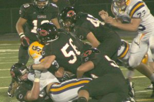 Defense delivered thunderous hits for the Papermakers all night long, at the brand new Doc Harris Stadium. Here, Odin Coe (bottom) wraps up a Columbia River ball handler with the help of Erik Clay, Ikaika Gunderson and Alex Hows (left to right).