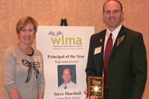 Camas High School Principal Steve Marshall stands with teacher-librarian Rosemary Knapp, after he won the Washington Library Media Association Principal of the Year award.