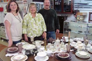 Belle Mathieu and her mother Debra Sampson and father Tony Sampson (left to right) are almost ready to open A Twist on Time, in downtown Camas. Grand opening festivities for the shop, which will feature antiques, art and unique items, are planned for Sunday.