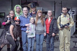 Tessa Rose stands with the glass-blowing team at the Tacoma Museum of Glass.