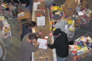 The Camas Fire Department's Grass Valley fire station was bustling Wednesday as employees from the CFD, as well as the Washougal Fire Department, East County Fire and Rescue, and the local community helped finish boxing up food and toys that were delivered later that day.  Through the Christmas Activities Relief Organization Limited program, area fire departments have been reaching out to local families in need for more than 50 years.