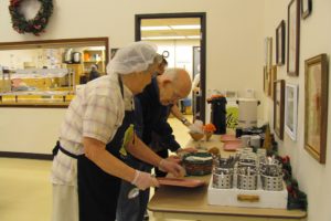 Volunteer Bessie Jarrel jokes with David Sanks at the Washougal Community Center during lunch, served daily by the Meals on Wheels People. The organization's goal is to expand the home delivery program to at least 100 people. "Right now we only serve 40, and that's a shame," Washougal Center Manager Wanda Nelson said. "There are so many more people we can help."