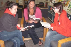 Camas High School students (from left) Ashley Mayfield, Cassidy Hines and Elizabeth Walsh are a part of the Papermaker Book Club. They enjoy the opportunity to discuss different books with other teens who share a love of reading.