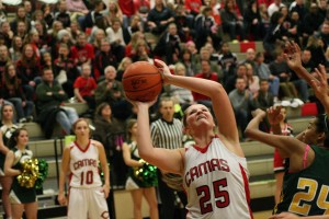 Nikki Corbett nets two of her team-leading 21 points Friday, at Camas High School. The Papermakers beat Evergreen 54-29.