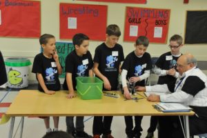 Before every FIRST LEGO League Robotics competition, a judge inspects the team's robot to ensure it meets requirements and asks questions. The Camas Mechanikids scored approximately 360 points, the highest of the contest. The second-place team scored approximately 298 points.