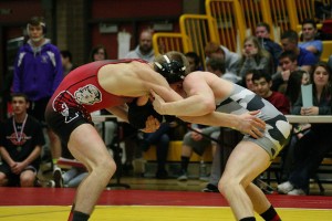 Camas' Bryant Elliott (left) and Union's Tommy Strassenberg grapple for the 145-pound championship at the Clark County tournament Saturday, at Prairie High School. Strassenberg defended Elliott at every turn and held on to a 5-3 victory.