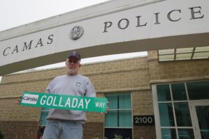 Dick Golladay holds a road sign given to him as a retirement gift from the Camas Police Department. He served his community as a Papermaker, firefighter, police officer and a landscaper. He looks forward to the next chapters of his life as a husband, father and a grandpa.