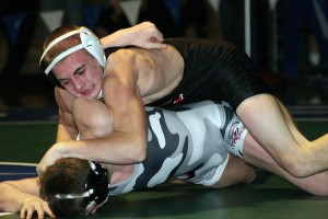 Bryant Elliott buries Daniel Rice's head into the mat during the 132-pound Clark County championship match Saturday, at Mountain View High School. The Camas Papermaker beat the Union Titan 15-11. See more photos at www.camaspostrecord.com.