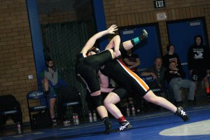 Erin Locke lifts Washougal teammate Morgan Ratcliff off the mat during the 130-pound Clark County championship match Saturday, at Mountain View High School in Vancouver. See more photos at www.camaspostrecord.com.