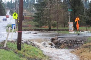 Water rushed across M Street, at 39th Street, from culvert to culvert, on Thursday following rainfall that totalled approximately 3 inches.