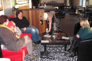 Friends celebrate with champagne Friday afternoon, at Flutes & Rocks Lounge, in downtown Camas. The new business also has cocktails, beer and sparkling wines, as well as meat and cheese plates, bacon and spinach dip and cheese and chocolate fondues. The owners, Dan and Krista Smark, also own DS Fabrication & Design Inc., in Washougal.