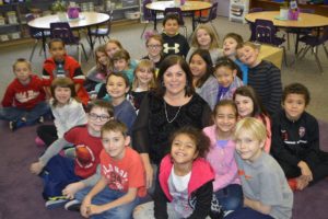 Laura Bolt, Hathaway Elementary School principal, will retire at the end of the school year. Here, she is pictured with students in Alexis McKee's third grade class.