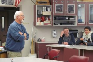 Croswell chats with his physics students about an upcoming final exam recently. "He's really good about explaining things based on real world experience," noted Kyle Binder, a senior.