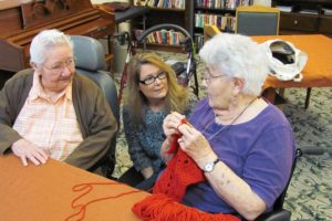 Deborah Campbell (center) interacts with residents at Columbia Ridge Senior Living. As the new community outreach director, Campbell handles the marketing and advertising of events at the retirement and assisted living community in Washougal. Future festivities, open to the public, include a talent show and Sunday brunches.