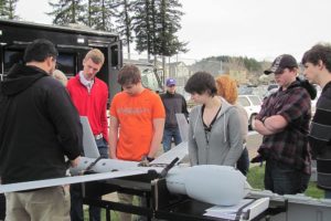 Bronson Ignacio, an employee with Insitu, educates students about drones and unmanned aircraft during career day at Washougal High School.