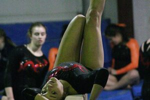 Emily Karkanen rolls backwards on the beam during the 4A district gymnastics meet Saturday, at Northpointe in Vancouver. Camas scored 162.1 points to beat out Heritage for the title by 1.5 points.