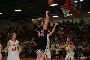 Jenka Stiasna puts the ball in the basket for Camas in the district championship game against Prairie Friday, at Fort Vancouver High School. The Falcons defeated the Papermakers 59-42.