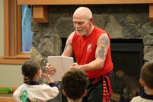 Maddie Vrtiska, 4, practices breaking a board during her Lil' Dragons Kung Fu class.