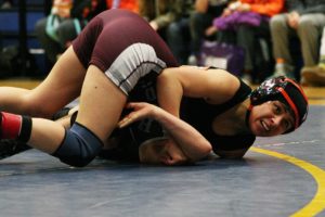 Washougal junior Yaneli Martinez pins Hoquiam sophomore Bree Hyder to win the 100-pound regional girls championship Saturday, at Kelso High School.