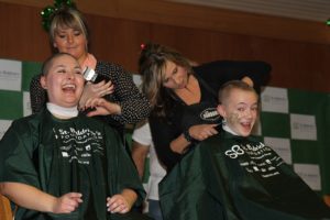 Pacific Crest Academy Middle School teacher Angela Dasso and sixth-grade student Jerrica Pachl shave their heads at the St. Baldrick's Foundation event on Jan. 25.