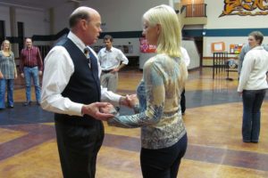 Dave Watson and his wife Jo Ellen Jarvis demonstrate the "West Coast Swing," while students in a Washougal Community Education & Recreation class observe. The Beginning Ballroom Dance class is held on Monday nights in the commons area of Washougal High School.