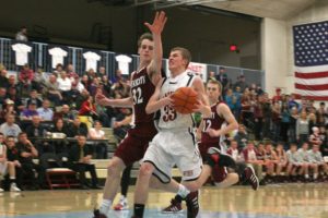 Jaden Jantzer (33) glides to the hoop for two of his 12 points off the bench for the Panthers in the district playoffs Saturday, at Mark Morris High School. He also hit two big 3-pointers in the game.