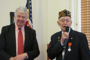 Fernald Shaw, 90, addresses the crowd gathered at Columbia Ridge Senior Living to see him receive the Legion of Honor (Chevalier) for his military service in France with the Allied Forces during World War II.  The award was given by Jack Cowan (left), honorary consul of France in Washington state.