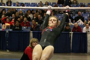 Caleigh Lofstead swings on the bars for the Papermakers at the state gymnastics meet Friday, in the Tacoma Dome. The CHS junior earned a 10.0 start value for the first time this season, and finished with a score of 8.25.