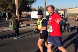 Kyle Robiduox (right) finished in third place in his division with the help of his guide Dan Streetman at the California International Marathon, in Sacramento. Robiduox is training for the Boston Marathon. His guides will be his sister-in-law Julie Kimmel, of Reston, Va., and brother Jayson Robiduox, of Camas.