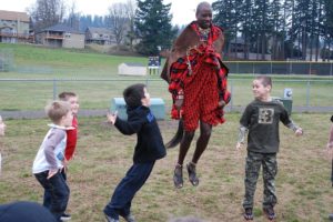 Sabore Ole Oyie, of Kenya, teaches Gause Elementary School second-graders a traditional dance that is typically performed following a successful lion hunt in the Ewaso Nyiro region. Ole Oyie is raising awareness and funds to complete two wells, which will allow for clean drinking water for 9,000 of the African region's residents.