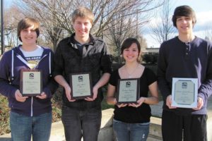 T Walker Anderson, Luke Block, Cortney Gonzalez and Austin Smith-Brown are all smiles after performing in the Washington Music Educators Symphonic Choir All-State concert recently. The four were selected out of hundreds of students from across Washington state.