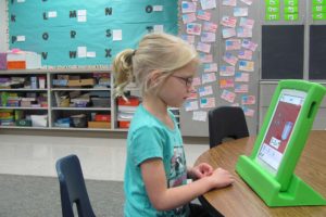 Addi Gibbons works with the "Teach Me Kindergarten" app on an iPad at Cape Horn-Skye Elementary School. Teacher Cindy Coons said the device is ideal for her students because it helps them learn at their own pace.