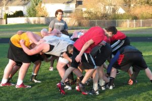 Jason Vailea walks his teammates through the rucking formation Thursday, at Skyridge.